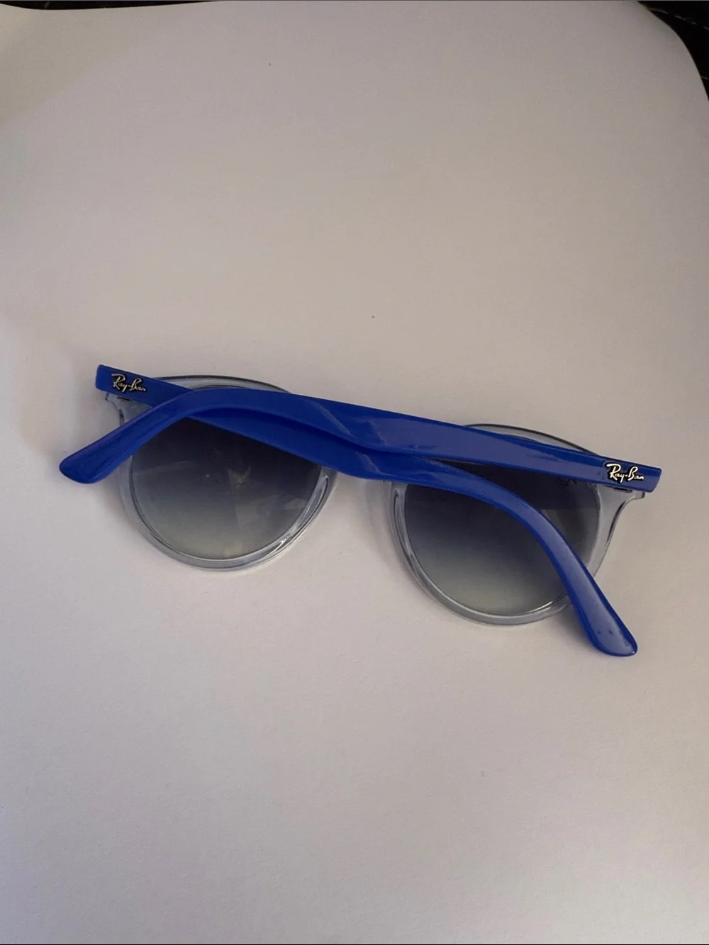 Ray-Ban Clear Frame Sunglasses with Blue Temples and Mirrored Lenses